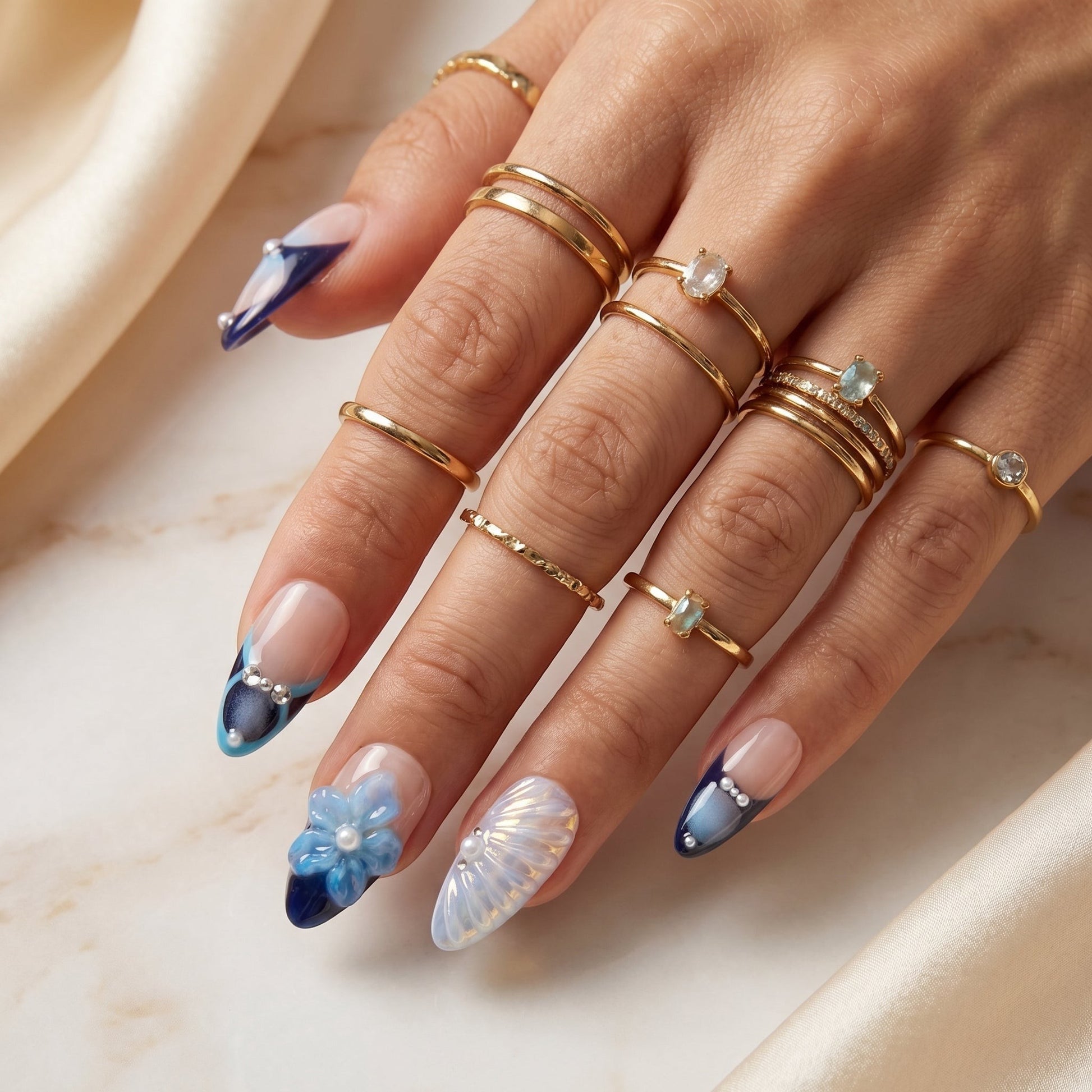 PearlFizzy luxury false nails in Tiffany blue with iridescent shell textures, 3D starfish, and pearl accents.