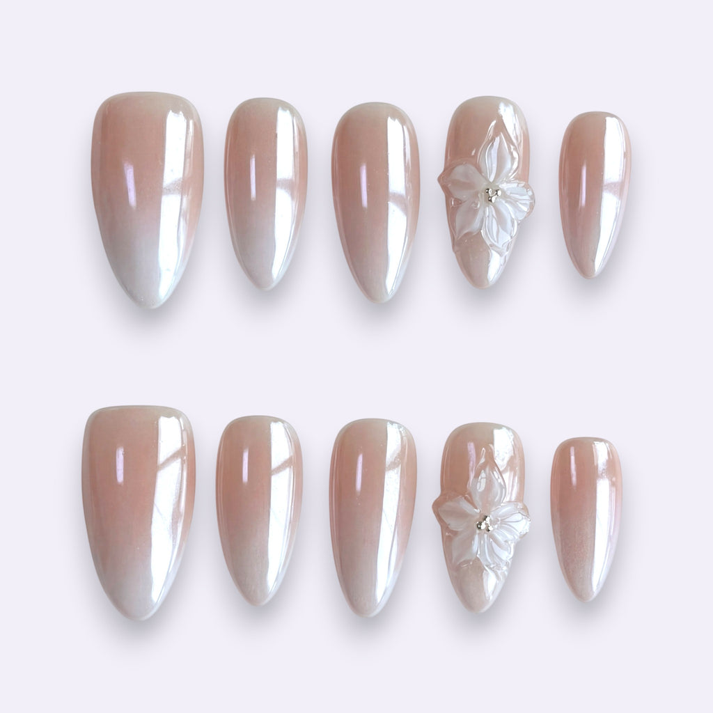 PearlFizzy Glazed Aurora handmade press-on nails with iridescent pearlescent finish and 3D transparent flowers.