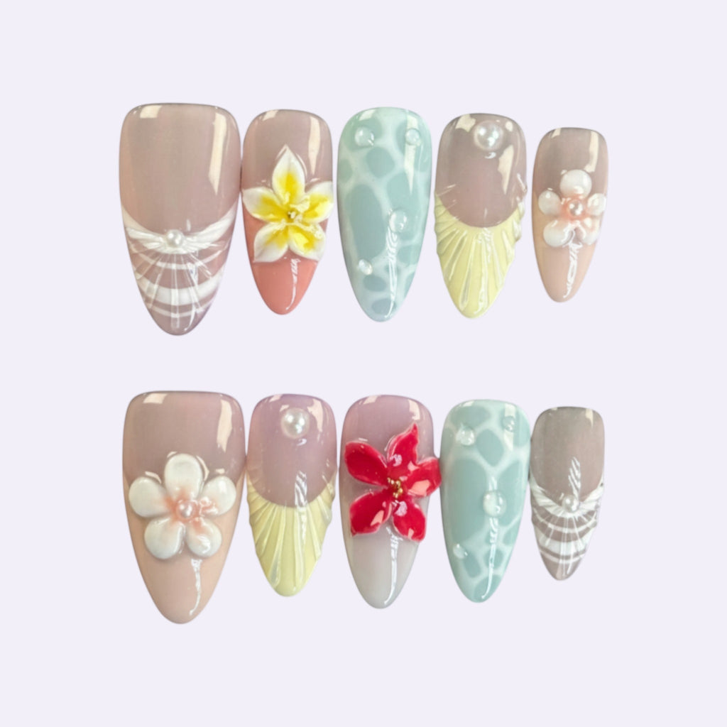 PearlFizzy Summer of Bubbles press-on nails with floral and pearl embellishments in pastel shades.